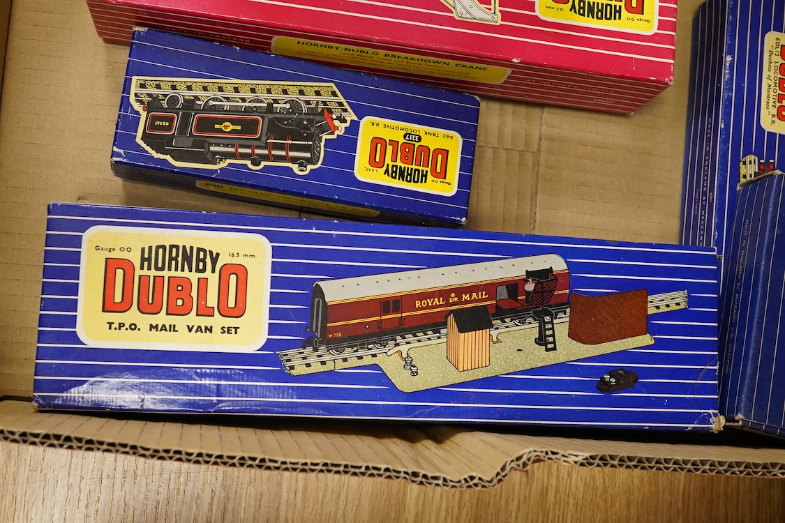 A collection of Hornby Dublo railway for 3-rail running, including three boxed locomotives; an LNER class A4 4-6-2 tender locomotive, Sir Nigel Gresley 7 (EDL1), a BR Duchess of Montrose 46232 (EDL12), and a BR class N2